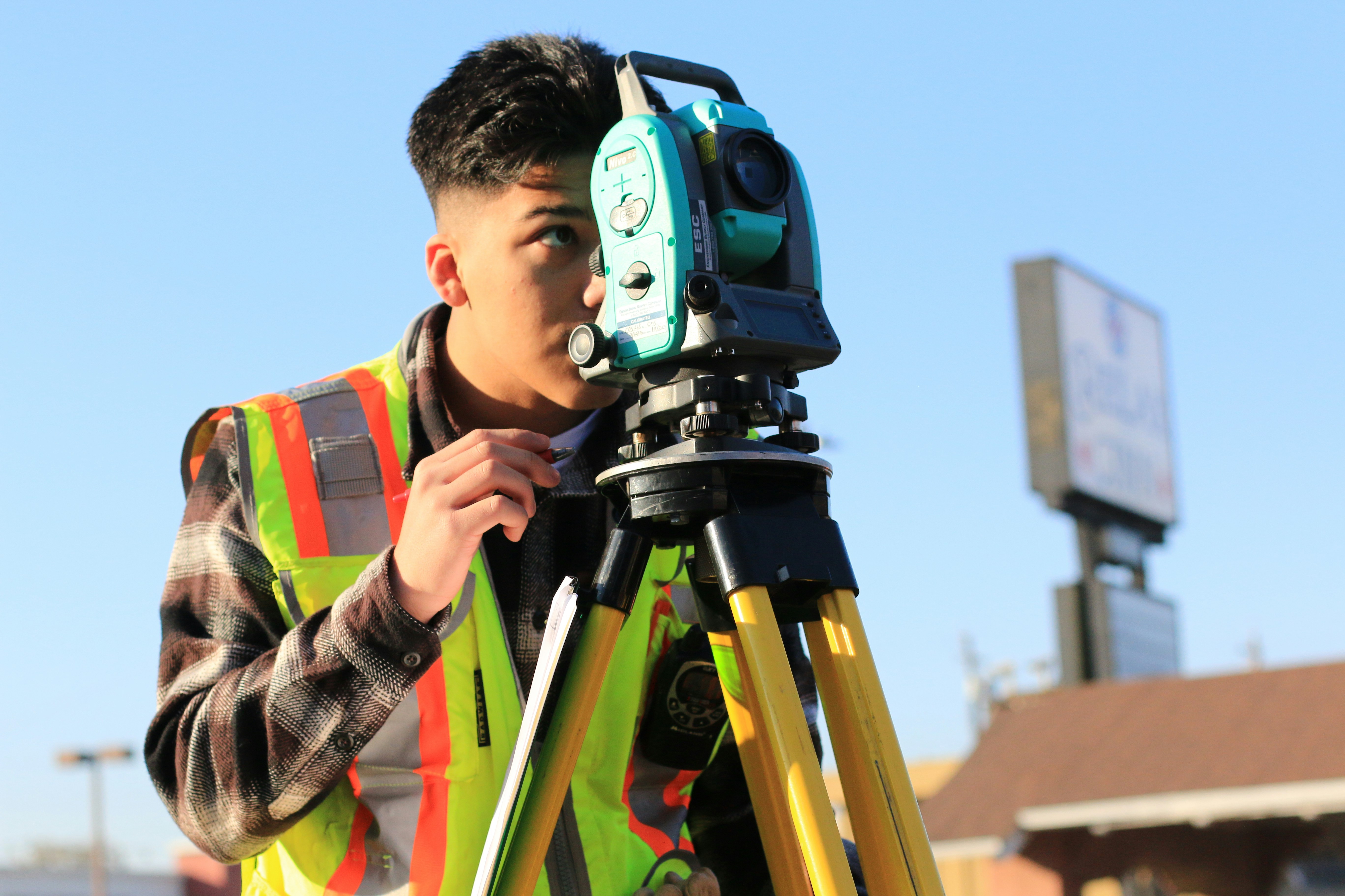 Case study | Knauf: Man looking through a theodolite