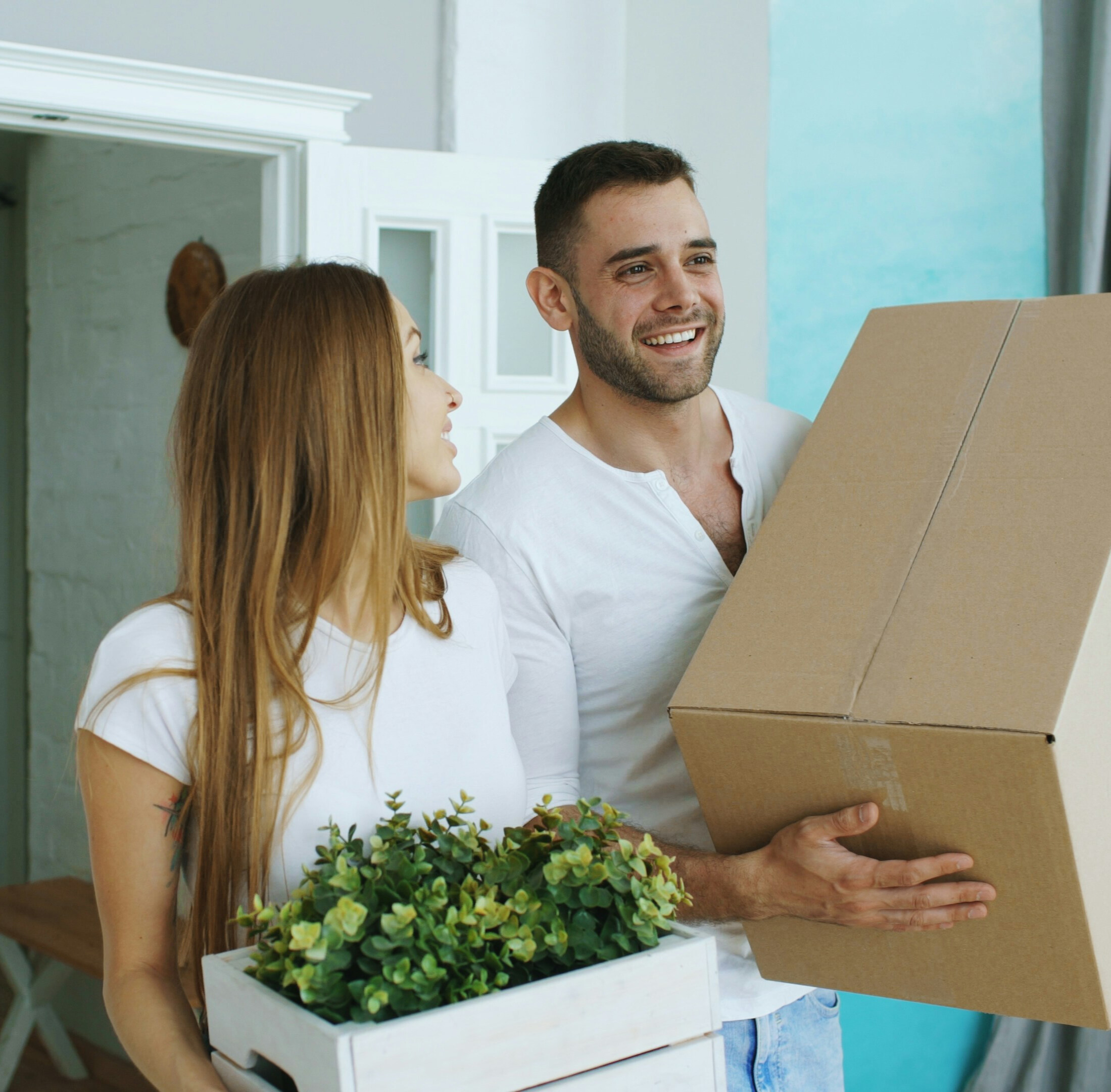 Case study | Together Housing: Couple holding plants and boxes