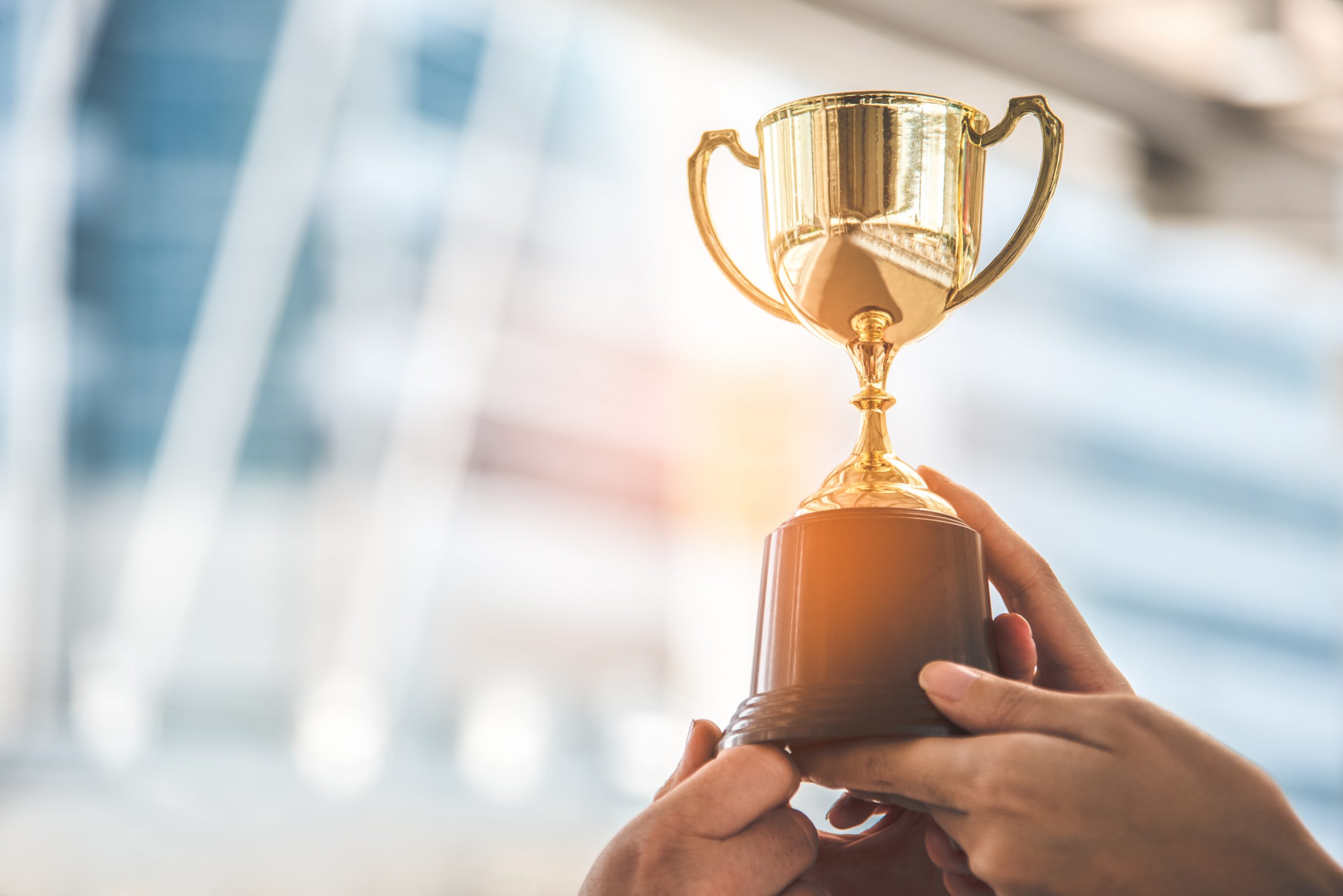 FlexGenius wins Personnel Today HR Technology Award | Trophy held aloft