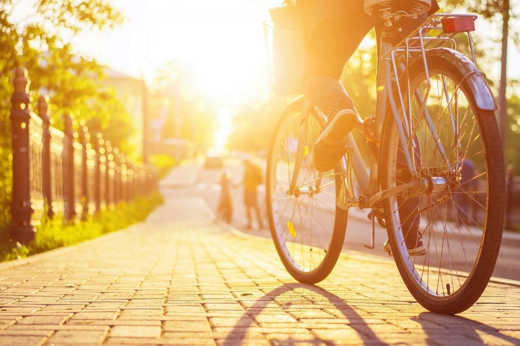 Creating a Sustainable Employee Benefits Plan | FlexGenius | Cycling in the sun